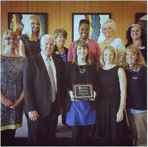Career Center staff posting with an award